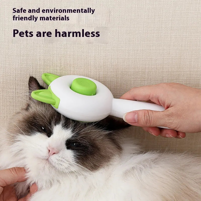 Greenish white pet grooming brush with stainless steel teeth, a push-button, and orange massage beads on the handle.