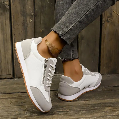Women's flat-heeled shoe in champagne colour with artificial PU upper and rubber sole.