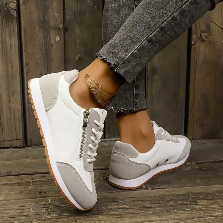 Women's flat-heeled shoes in grey, white and champagne colours, featuring a lightweight artificial PU upper and durable rubber sole. Available in a wide range of sizes from EU 31 to 44 for adult female wearers.