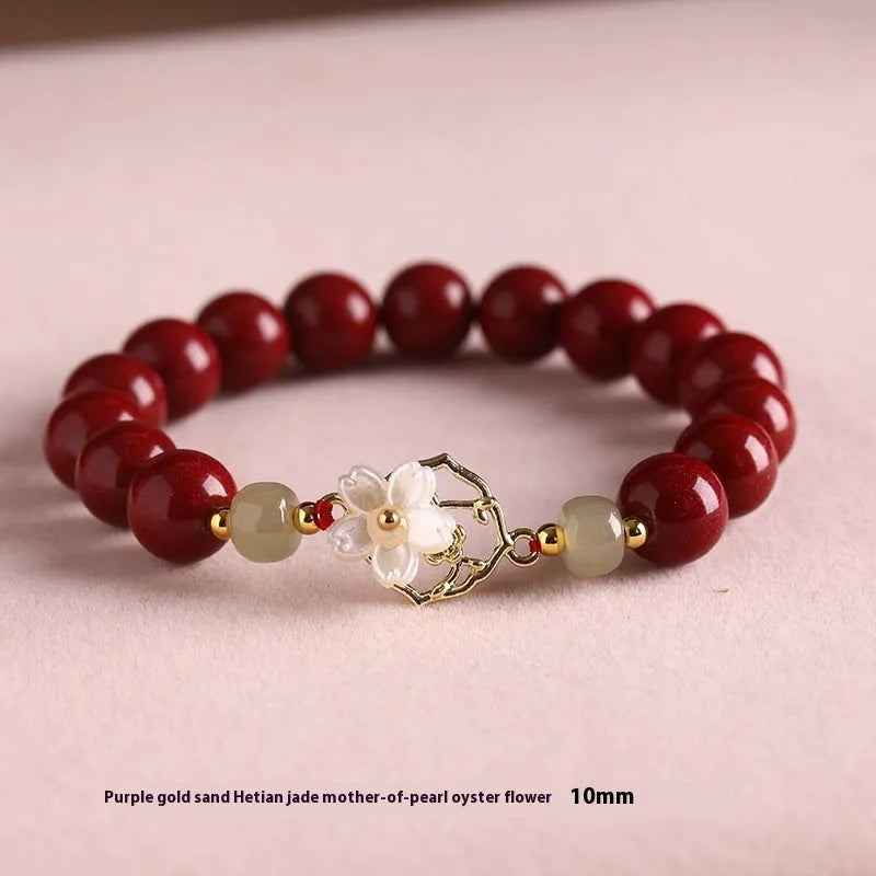 Handcrafted Hetian Jade New Chinese style bracelet in cinnabar with white butterfly, lotus and bells of Ireland motifs
