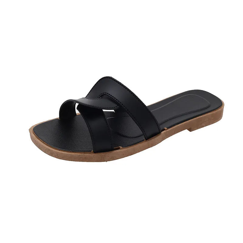 Women's PVC toe ring slippers with a cross strap in milky white, shown from a side angle.