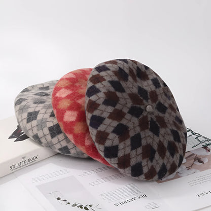 Wool plaid beret with dome crown, adjustable size, and tassel and mesh detail in blue light coffee plaid.