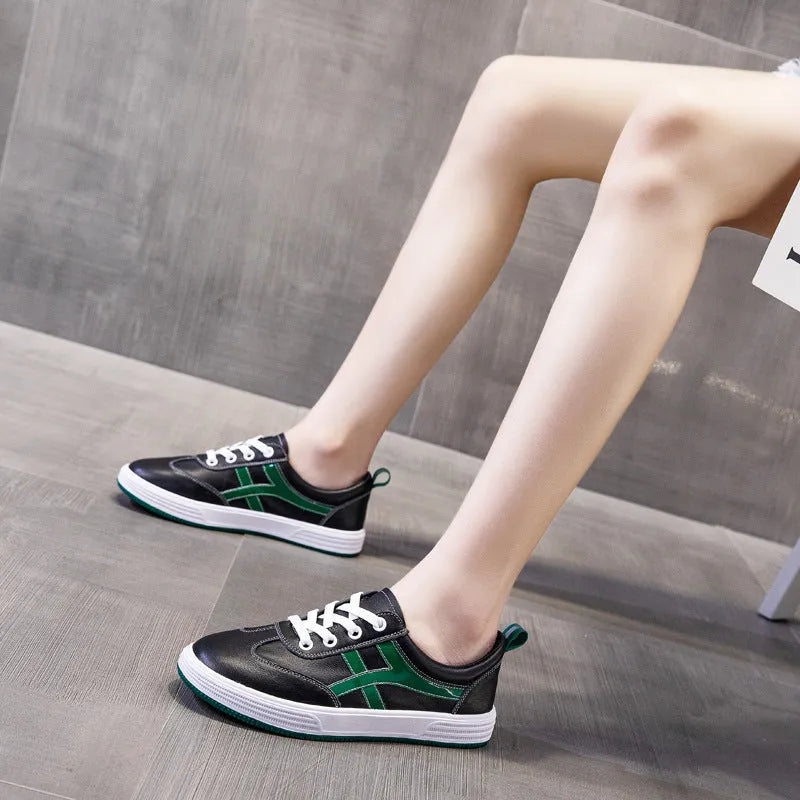Korean style casual sneakers with elastic bands, cowhide upper and round toe in white or black