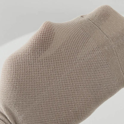 Pair of solid colour low-cut polyester boat socks for men, shown in one of six available colour options.