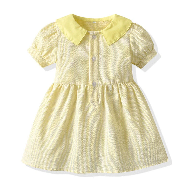 Girl wearing yellow plaid princess cotton dress with matching lace straw hat summer set
