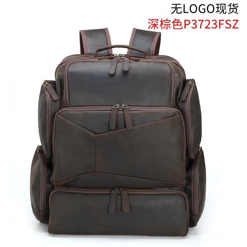 Dark brown leather backpack with embossed texture, double shoulder straps, and multiple zippered compartments for 17-inch laptops