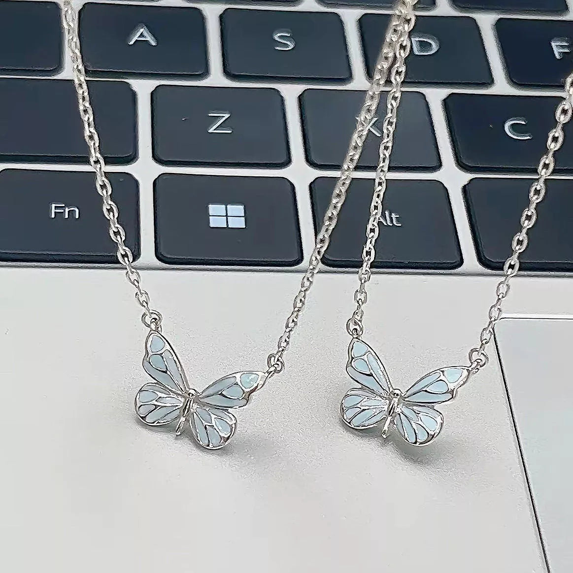 Glow-in-the-dark blue butterfly necklace and bracelet set for women, perfect for parties and gifts.