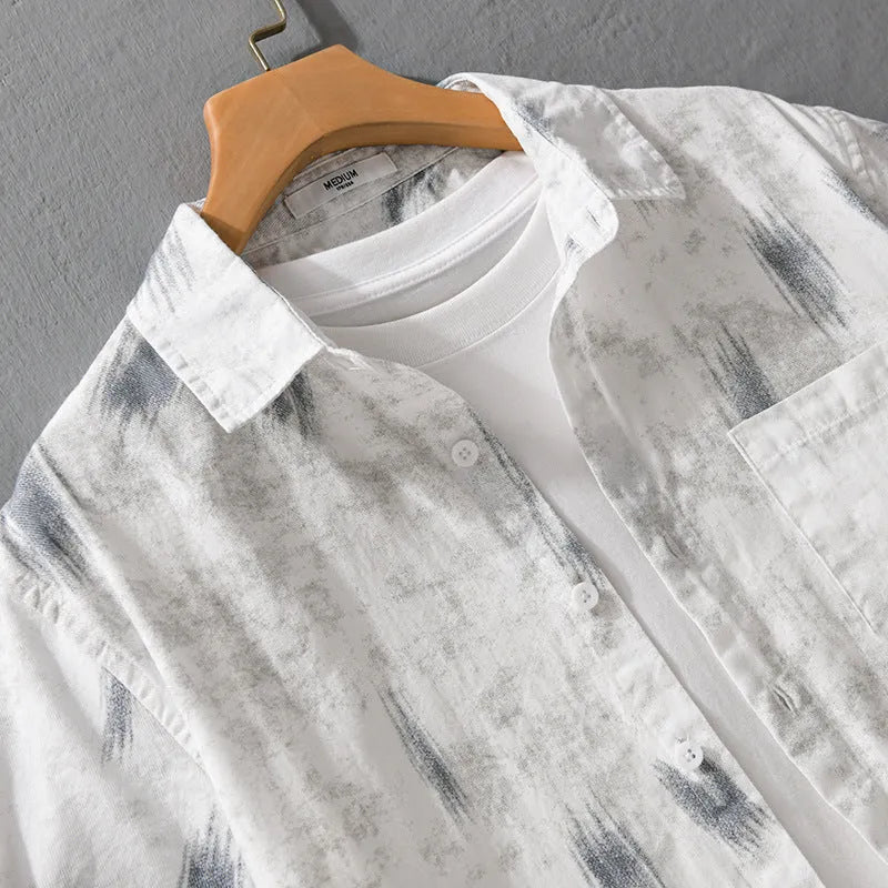Men's light green floral print cotton cardigan with short sleeves on a hanger.