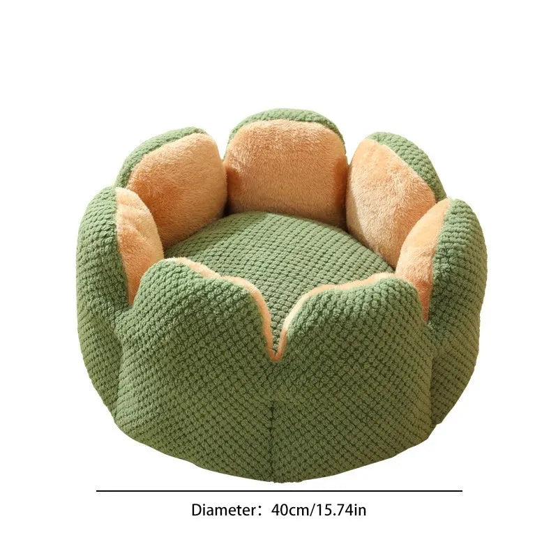 Green cactus petal shape pet bed for cats and dogs on a hardwood floor.