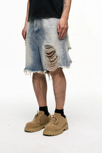 Men's light blue denim shorts with a baggy wide-leg and retro washed finish