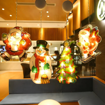 LED Christmas hanging lights with suction cups showing snowman design illuminated on window