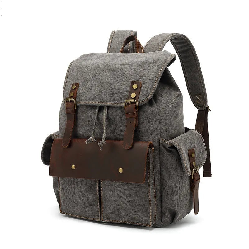 Retro canvas backpack in army green with antique bronze hardware, showing front compartments and size.