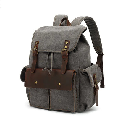 Retro canvas backpack in army green with antique bronze hardware, showing front compartments and size.