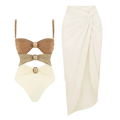 Women's green one-piece swimsuit with round buckle decoration and hollow-out stitching detail on nylon fabric.