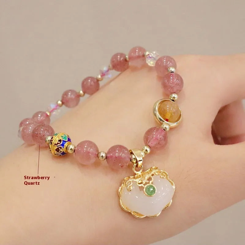 Geometric ethnic style jade bracelet for women with metal charm decoration in gray or strawberry quartz.