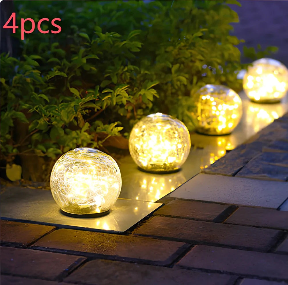 Cracked glass ball LED solar light, 10cm size with warm white glow for garden paths, waterproof and ground stake included