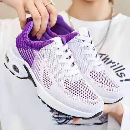 Women's striped Flyknit casual running shoes in pink, shown with a flat PVC sole and front lace-up closure.