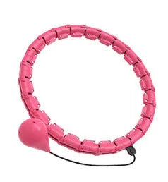 Pink massage soft ball with a detachable black belt, shown on a fitness mat.