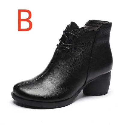 Women's brown leather retro Martin boots with a thick block heel and round toe on a wooden floor.