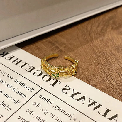 Copper women's ring with Chinese butterfly design and adjustable open loop.