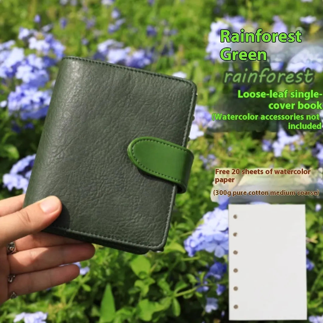 A7 sized loose-leaf watercolour notebook with textured cover, open to show flat-laying pages.