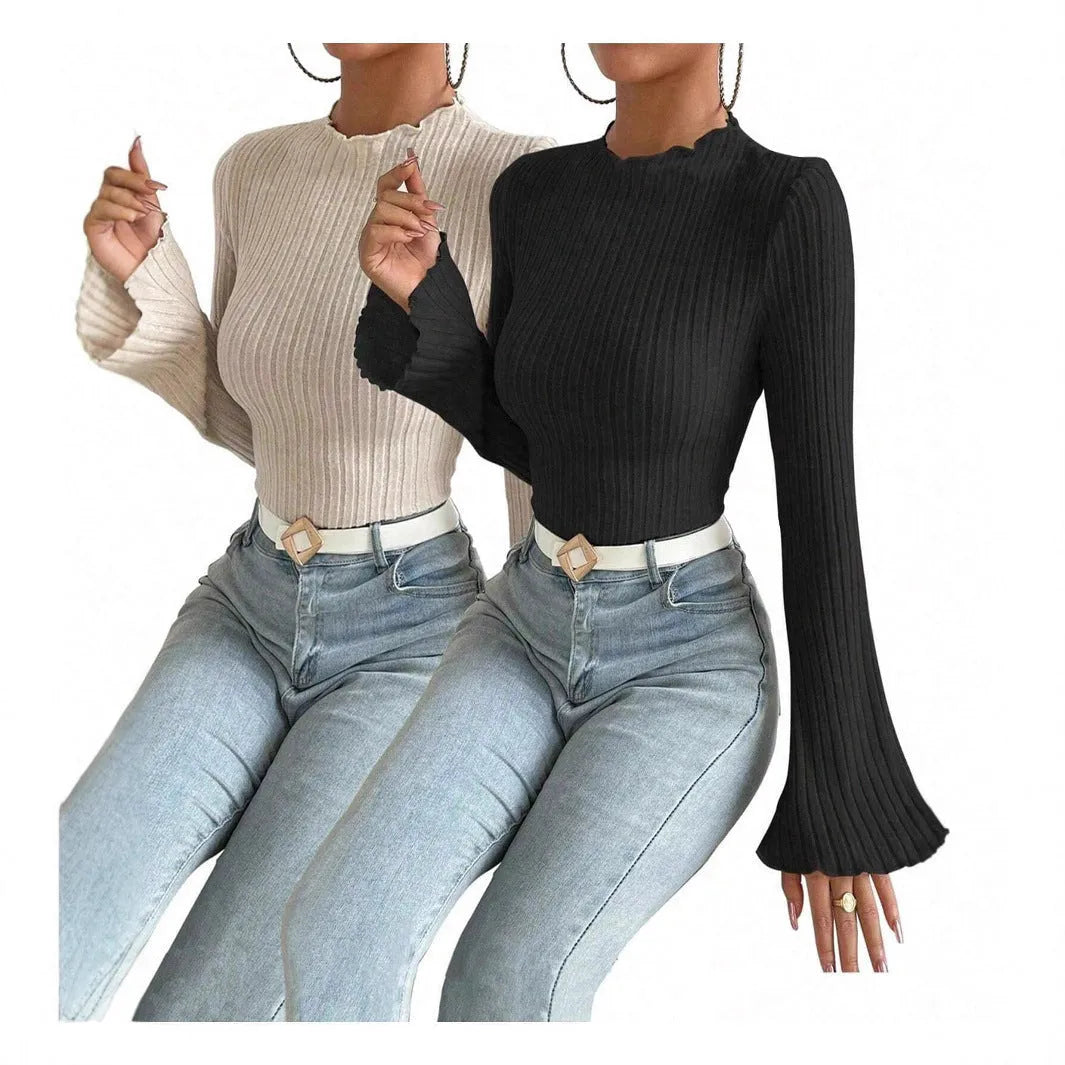Long sleeve round neck top in black with lantern sleeves and slim fit, on a hanger