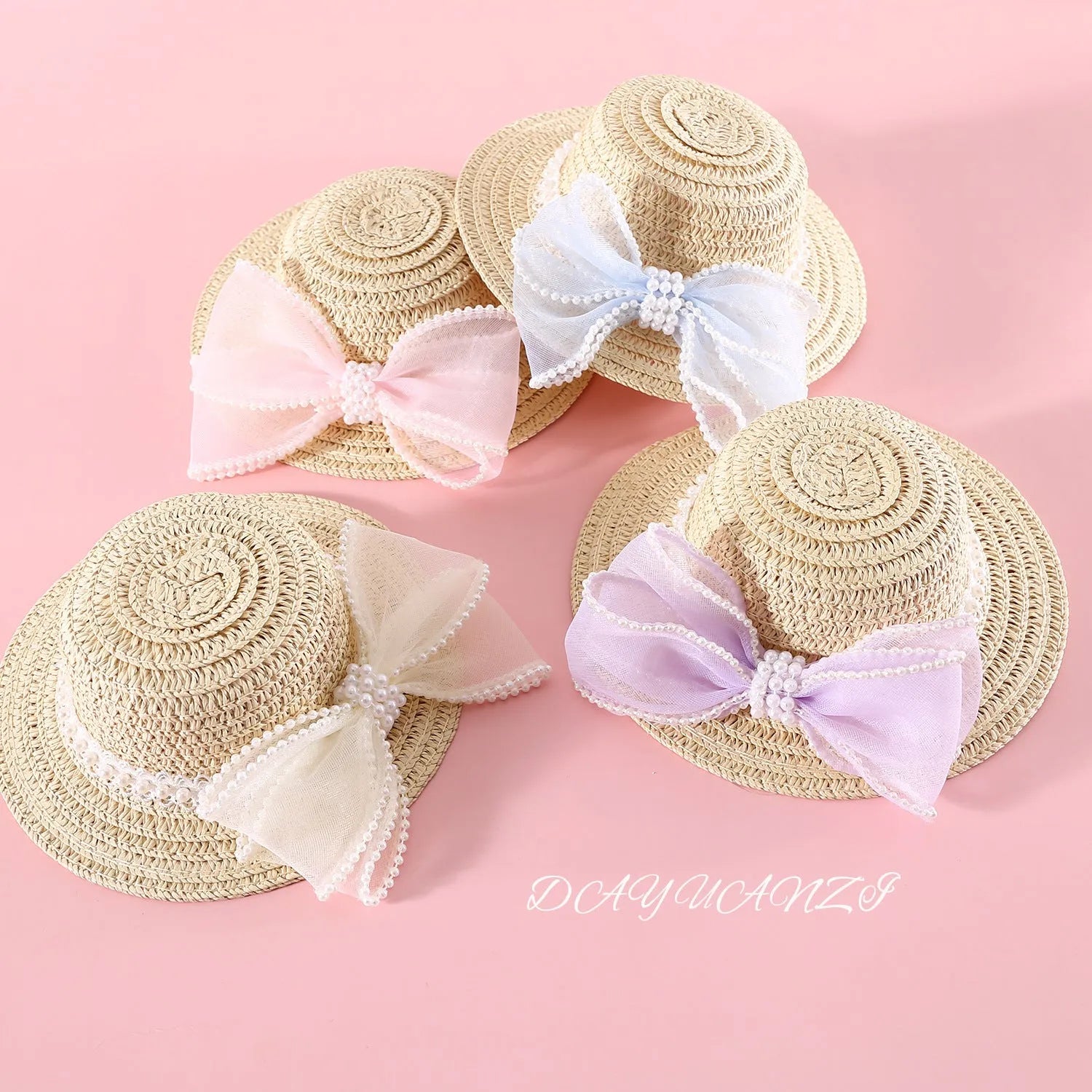 A woven Lafite leaf hat for cats with a pearl butterfly bow, shown in pink, purple, blue, and white colour options.
