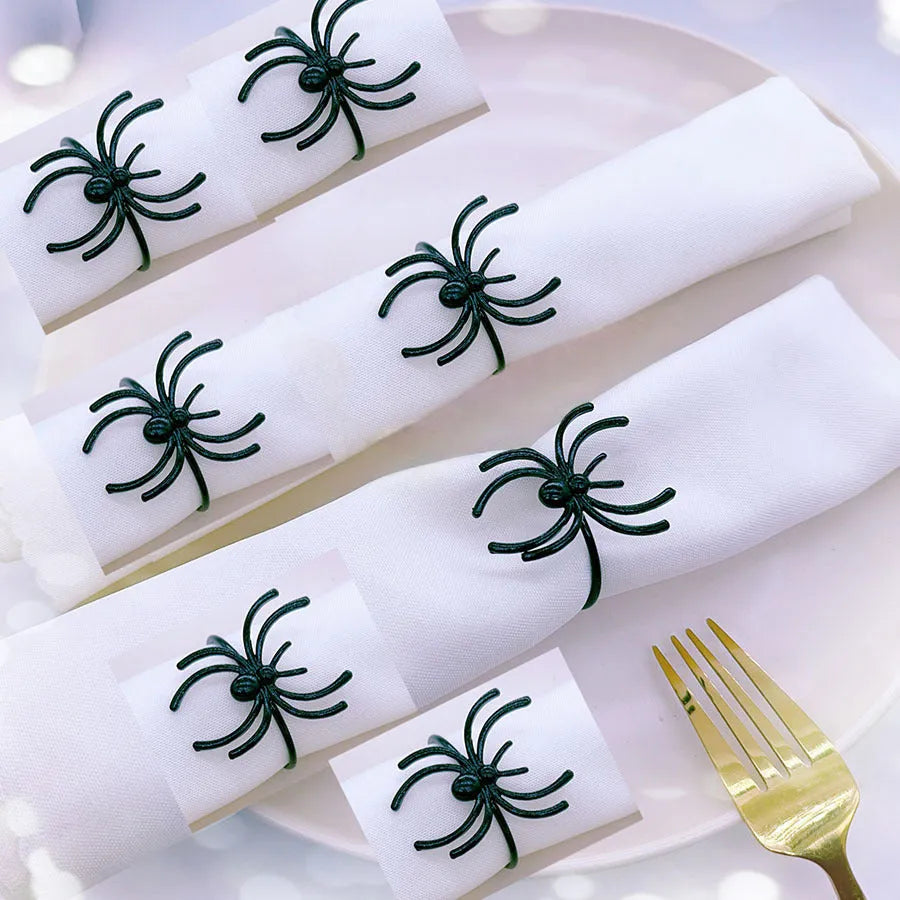 Six black spider-shaped alloy napkin rings with electrophoresis coating for Halloween table settings