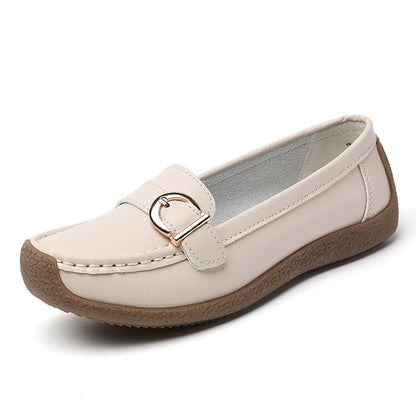 Women's beige casual loafers with round toe and flat heel on a white background.