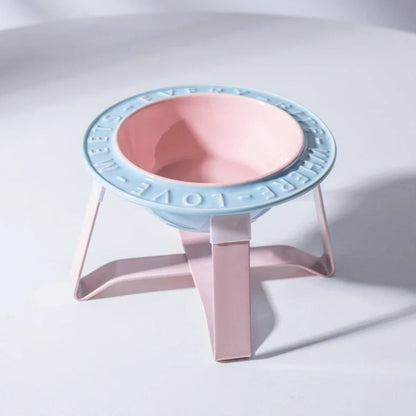 Ceramic cat bowl with iron anti-tip frame in blue colour with silicone pad