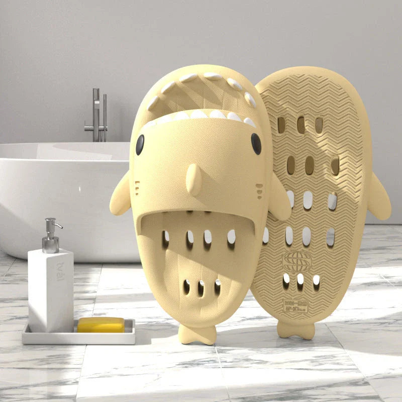 Colorful shark-themed shower slides with drainage holes, designed for comfortable and practical use in the pool or shower.