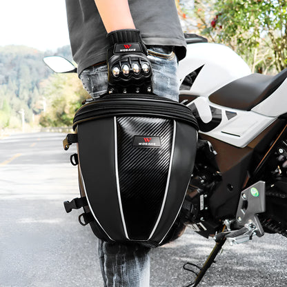 Black waterproof motorcycle tail bag with reflective stripe, showing multiple pockets and a carrying strap.