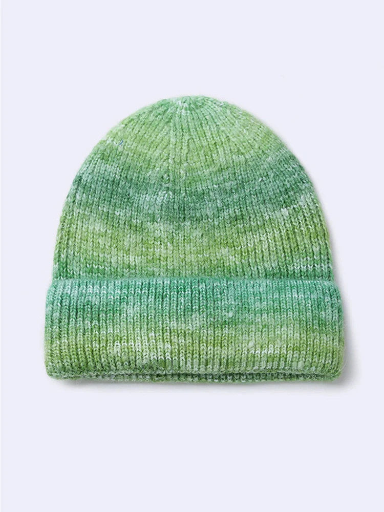 Gradient yarn knitted hat with tapered top in light blue colour showing knitted texture