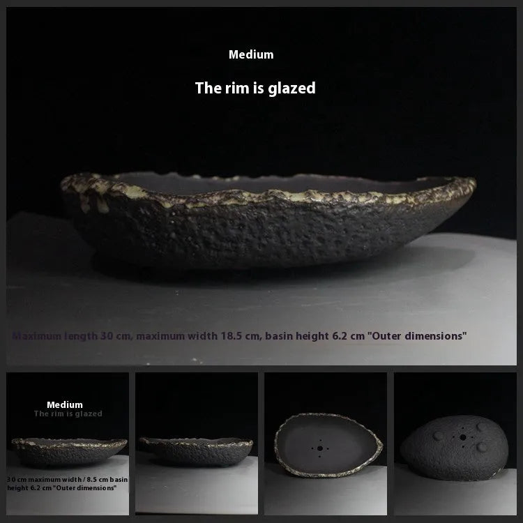 Handmade purple clay flower pot with unique shape showing natural ceramic texture