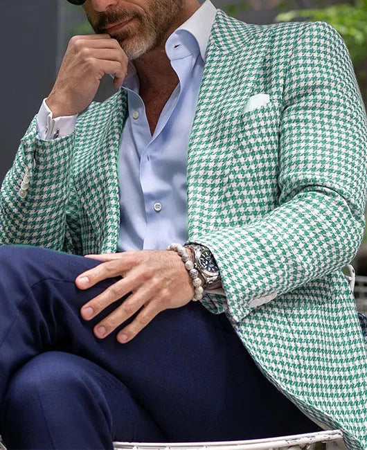 Men's slim fit two-button suit jacket with large top-stitch pockets in a polyester blend fabric.