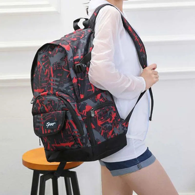 Blue classic nylon backpack with multiple compartments and adjustable straps, shown with laptop sleeve