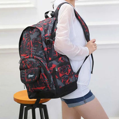 Blue classic nylon backpack with multiple compartments and adjustable straps, shown with laptop sleeve