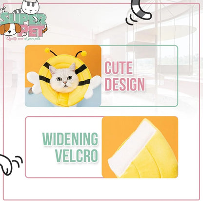 Soft fabric cat cone collar with cute bee design and Velcro closure on a table