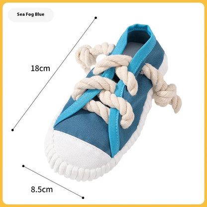 Durable plastic dog chew toy in slipper shape with bends, in yellow, black, or blue.