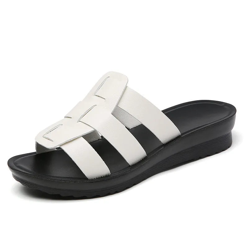 Women's large size flat bottom slippers in beige, black and brown colours with PU leather construction