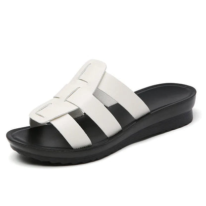 Women's large size flat bottom slippers in beige, black and brown colours with PU leather construction