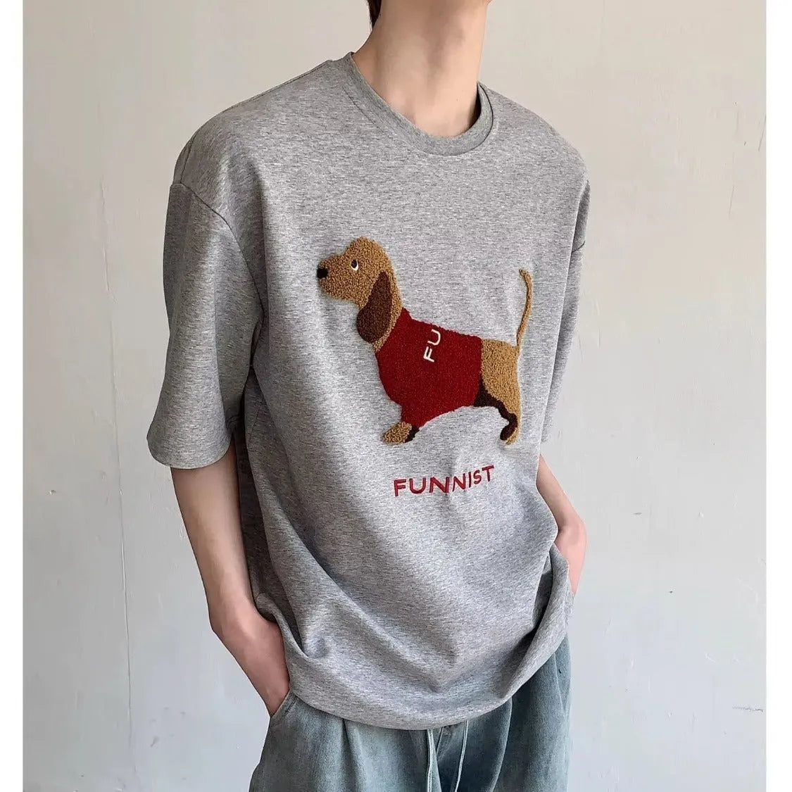 Men's grey cotton t-shirt with embroidered sausage dog design on front, short sleeves, round neck