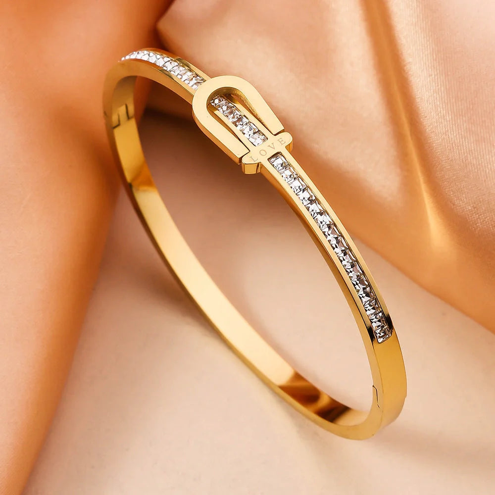 Exquisite gold-plated stainless steel bracelet with a unique and eye-catching design, perfect for adding a touch of elegance to any outfit.
