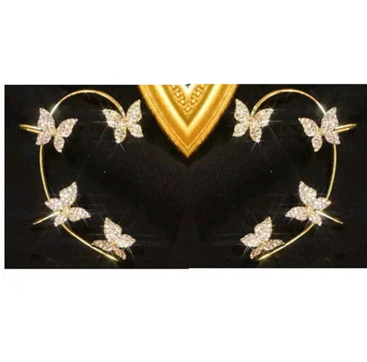 Fashionable butterfly-shaped ear clips in gold and silver tones, showcasing a chic, European-inspired design.