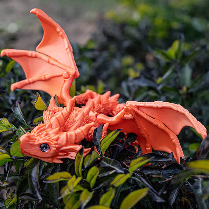 Red and gold 3D printed plastic dragon wings decoration for costumes.