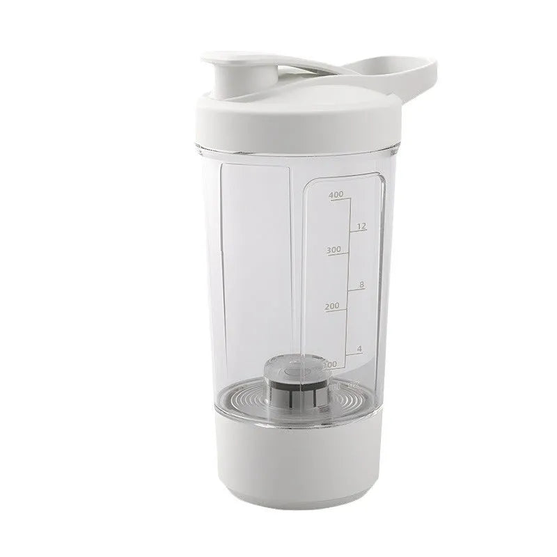 Black electric protein shaker bottle with lid and USB charging cable on a table