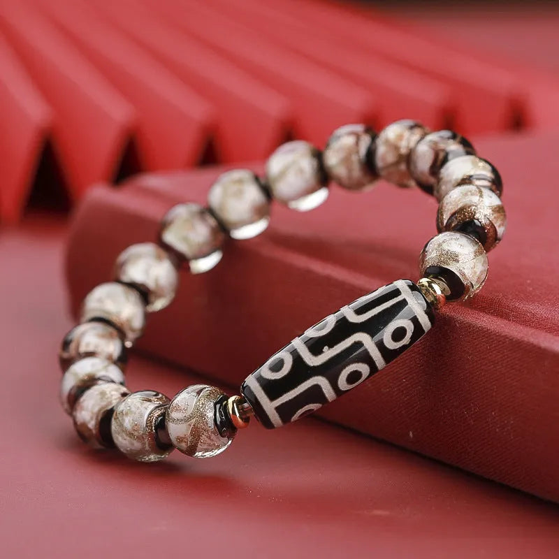 Colourful Chinese-style coloured glaze bracelet with auspicious patterns and snake symbol on beads.