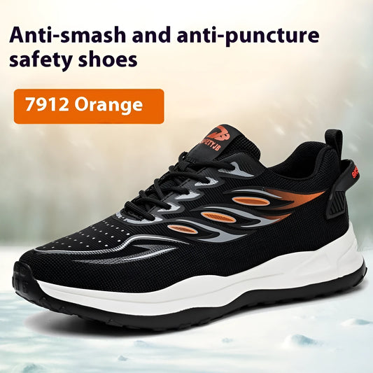 Lightweight orange and grey safety shoes with leather upper and rubber sole on a work floor.