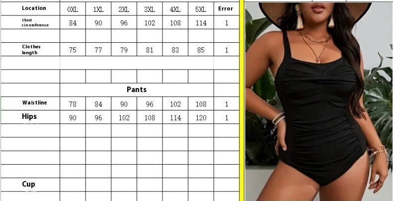 Black solid colour plus size one-piece swimsuit for women on a hanger.