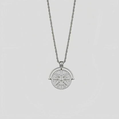 Circular stainless steel pendant necklace with sunflower embossing and star designs on adjustable hemp flower chain
